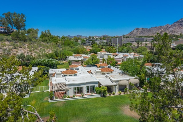 birds eye view of property with a mountain view