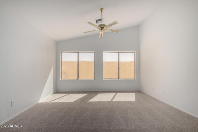 unfurnished room with lofted ceiling, ceiling fan, carpet flooring, and baseboards