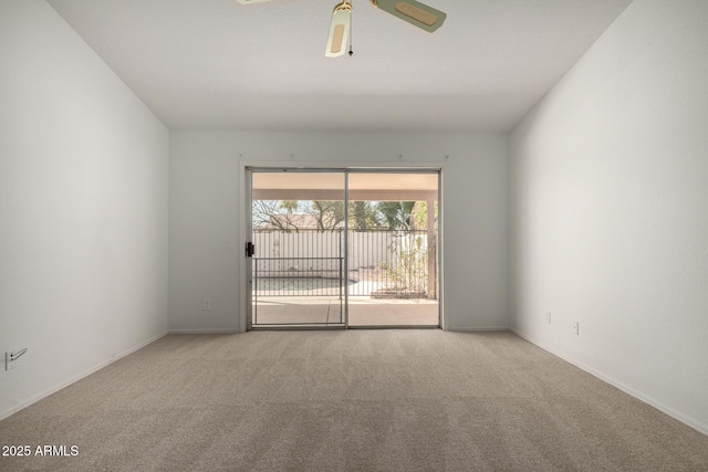 empty room with baseboards, a ceiling fan, and carpet flooring