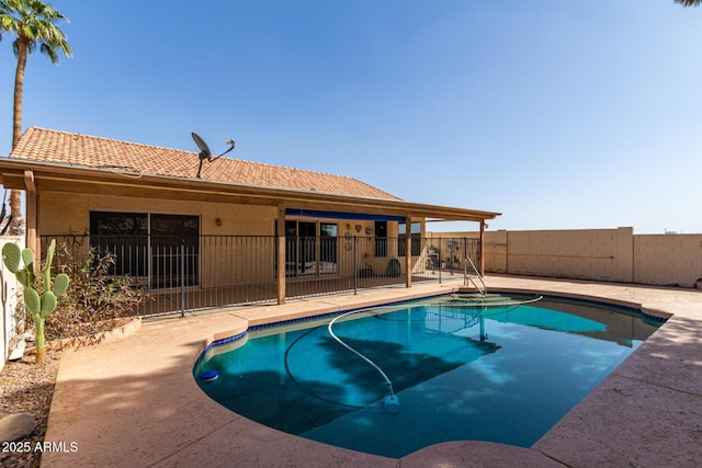 view of pool featuring a patio area, a fenced backyard, and a fenced in pool