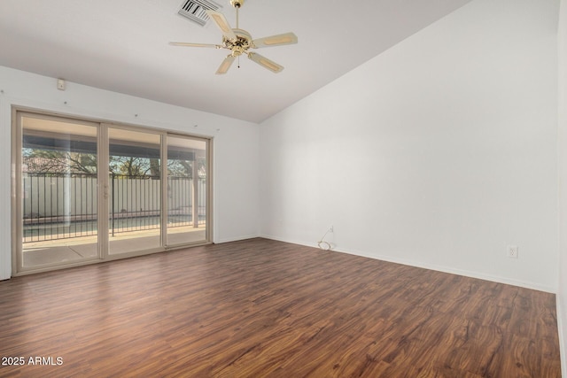 empty room featuring lofted ceiling, ceiling fan, wood finished floors, visible vents, and baseboards