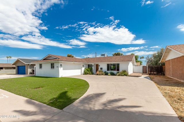 ranch-style house featuring a garage and a front lawn