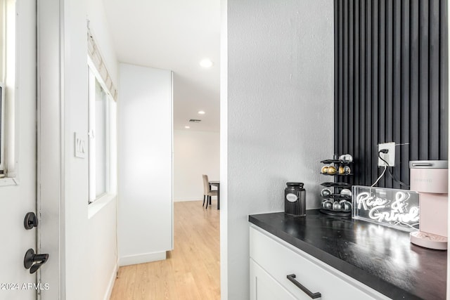 bathroom with vanity and wood-type flooring