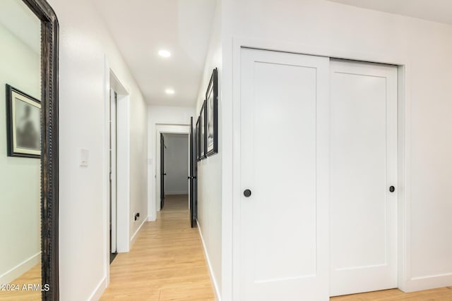 corridor featuring light hardwood / wood-style floors