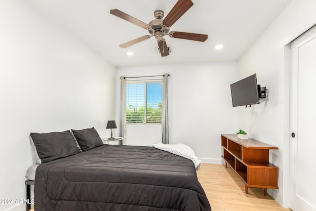 bedroom featuring ceiling fan and light hardwood / wood-style flooring