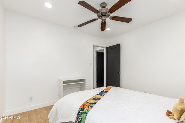 bedroom featuring light wood-type flooring and ceiling fan