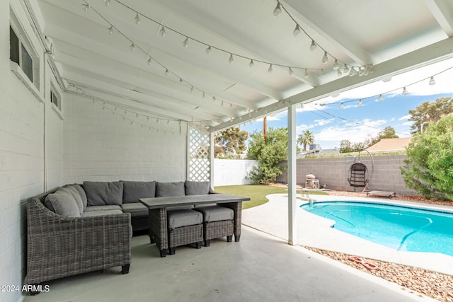 view of pool with outdoor lounge area and a patio