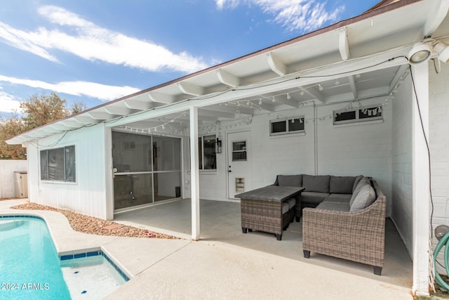 exterior space featuring a sunroom, an outdoor living space, and a patio area