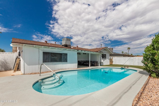 view of swimming pool with a patio