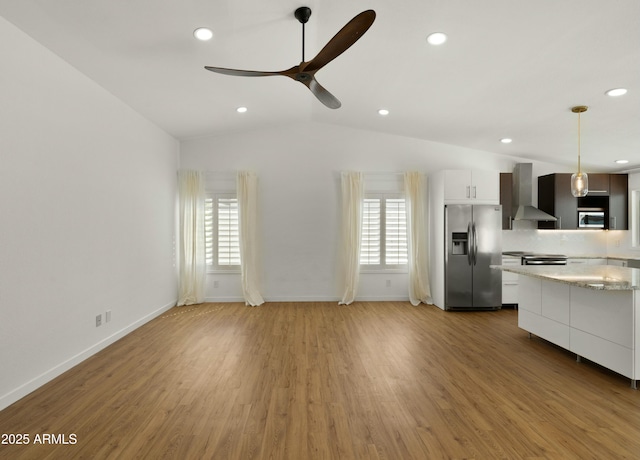 6833 E Grandview Dr, Scottsdale, AZ 85254 - kitchen with recessed lighting, a ceiling fan, decorative light fixtures, wall chimney exhaust hood, and stainless steel appliances