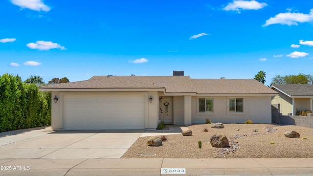 6833 E Grandview Dr, Scottsdale, AZ 85254 - ranch-style home with an attached garage, fence, stucco siding, driveway, and roof with shingles