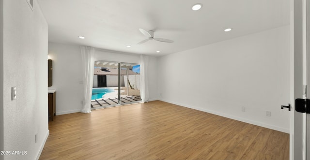 6833 E Grandview Dr, Scottsdale, AZ 85254 - spare room featuring recessed lighting, baseboards, a ceiling fan, and wood finished floors