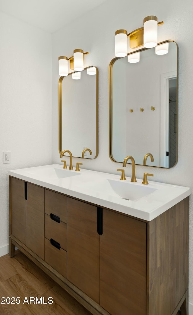 6833 E Grandview Dr, Scottsdale, AZ 85254 - full bathroom with a sink, double vanity, and wood finished floors