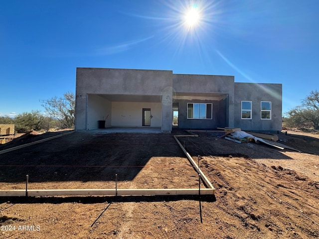 16029 E Rancho Laredo Dr, Scottsdale, AZ 85262 - back of property featuring dirt driveway and stucco siding