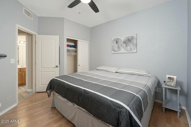 bedroom featuring a closet, ceiling fan, and light wood-type flooring