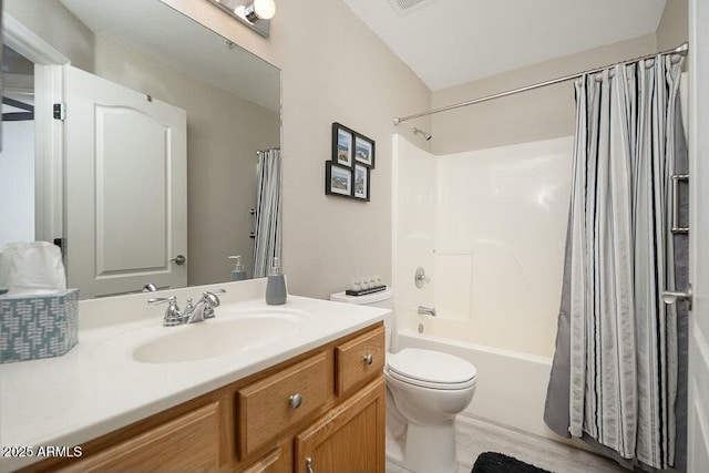 full bathroom with shower / tub combo with curtain, vanity, and toilet