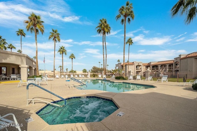 view of pool featuring a community hot tub and a patio area