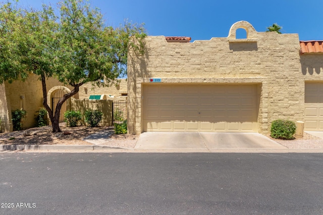 1235 N Sunnyvale Unit 113, Mesa, AZ 85205 - view of front of property with stucco siding, a garage, and a tiled roof