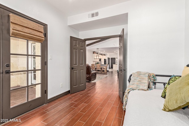 1235 N Sunnyvale Unit 113, Mesa, AZ 85205 - bedroom featuring dark wood-style floors, a chandelier, and baseboards