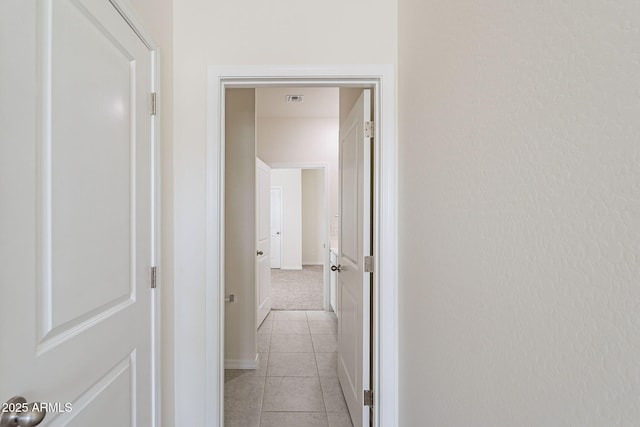 19354 W Coolidge St, Litchfield Park, AZ 85340 - hallway featuring light tile patterned floors, baseboards, and visible vents