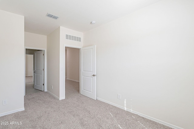 19354 W Coolidge St, Litchfield Park, AZ 85340 - unfurnished bedroom with carpet floors, visible vents, and baseboards