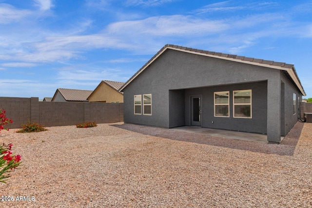 19354 W Coolidge St, Litchfield Park, AZ 85340 - back of property with a fenced backyard, a patio, and stucco siding