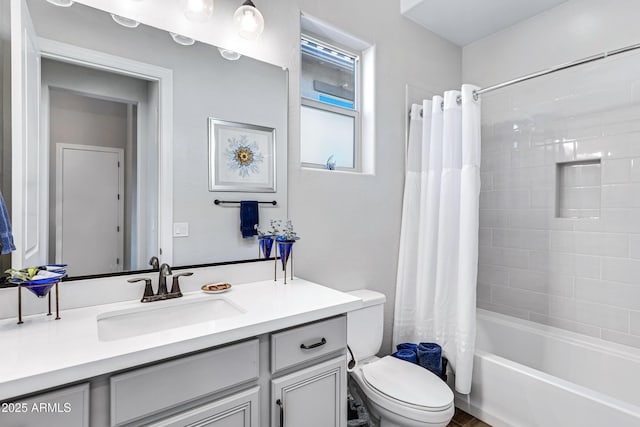 full bathroom with vanity, toilet, and shower / bath combo with shower curtain