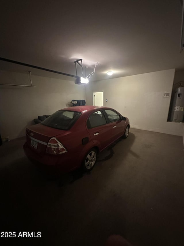 garage featuring a garage door opener and water heater