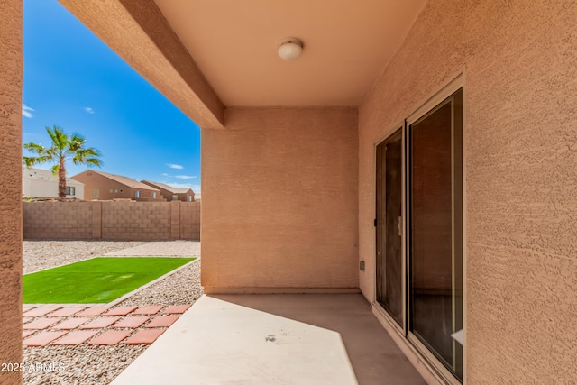 view of patio / terrace featuring fence