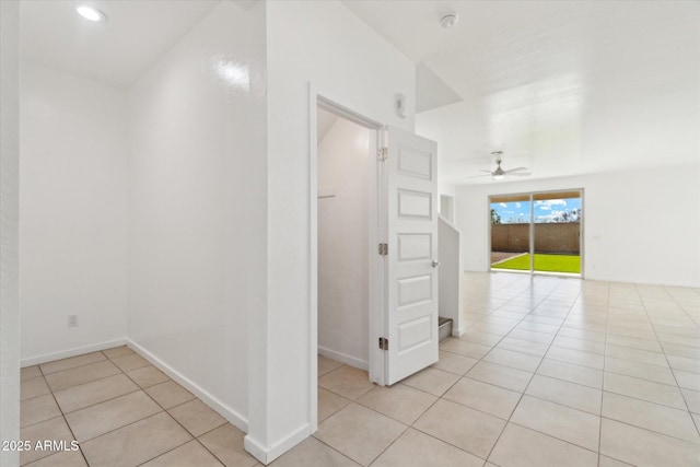 corridor featuring light tile patterned floors