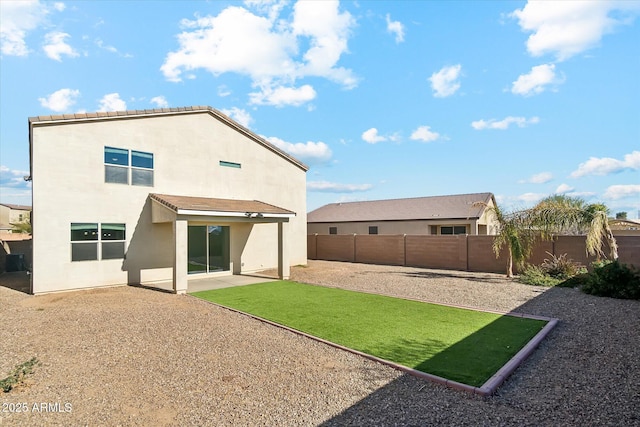 back of house with a patio area