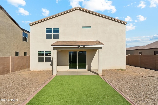 back of property featuring a patio area