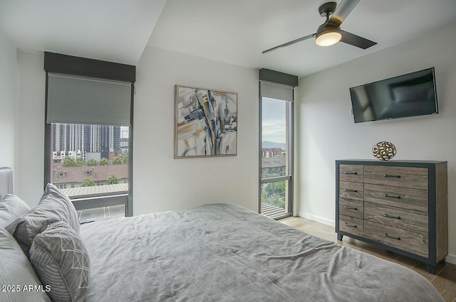 bedroom with baseboards and ceiling fan