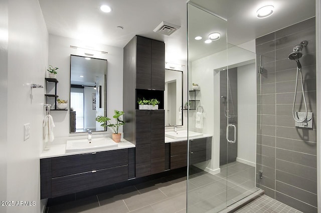 bathroom featuring a sink, two vanities, recessed lighting, and a shower stall