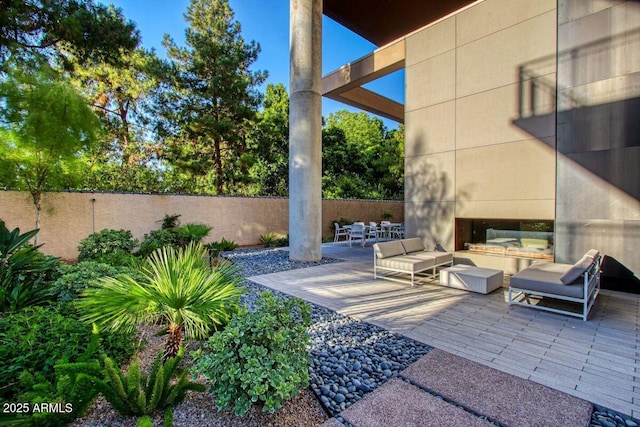 view of patio with a fenced backyard and outdoor lounge area