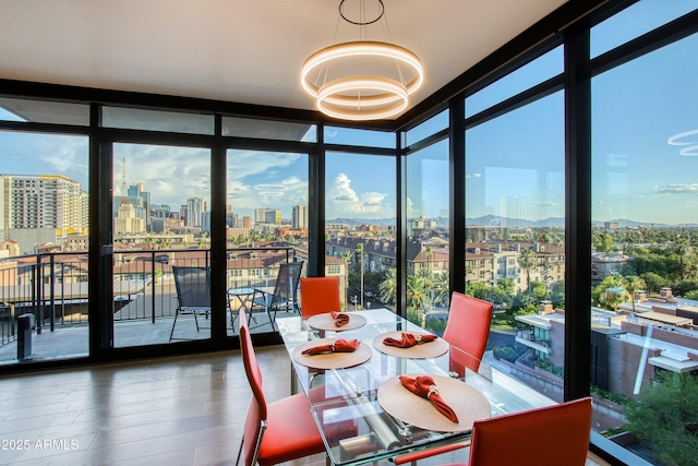 sunroom with a city view and plenty of natural light