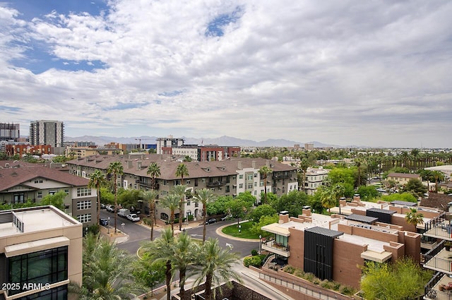 birds eye view of property with a mountain view