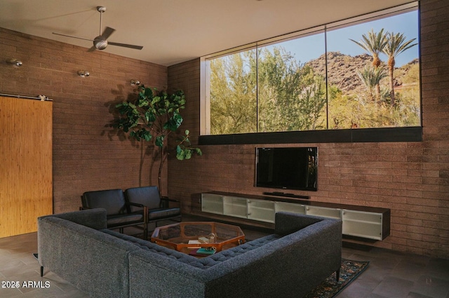 interior space with a ceiling fan and an outdoor living space