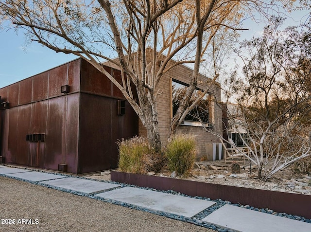 view of property exterior at dusk