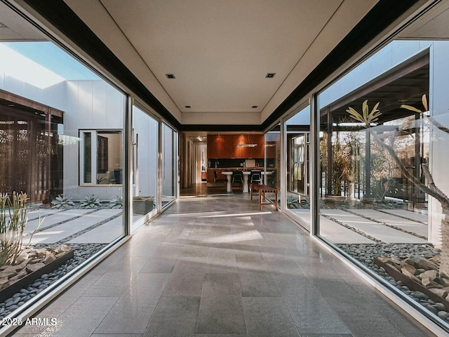 unfurnished sunroom with visible vents