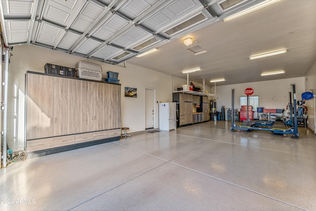 garage with white fridge