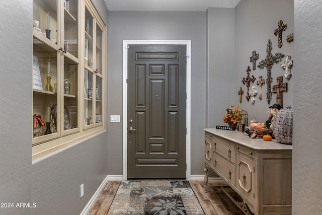 doorway featuring dark hardwood / wood-style flooring