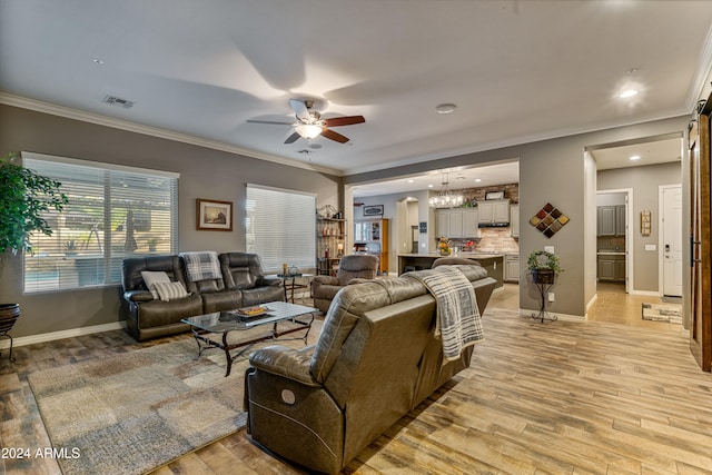 living room with ceiling fan with notable chandelier, crown molding, and light hardwood / wood-style flooring