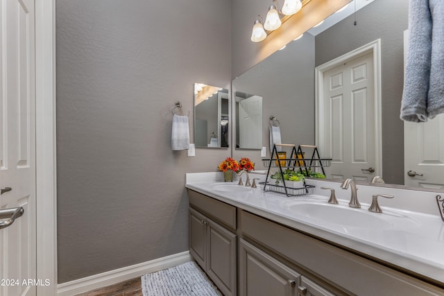 bathroom featuring hardwood / wood-style flooring and vanity