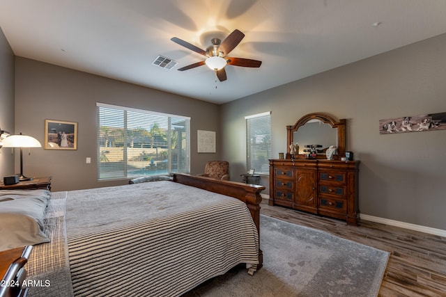 bedroom with wood-type flooring and ceiling fan