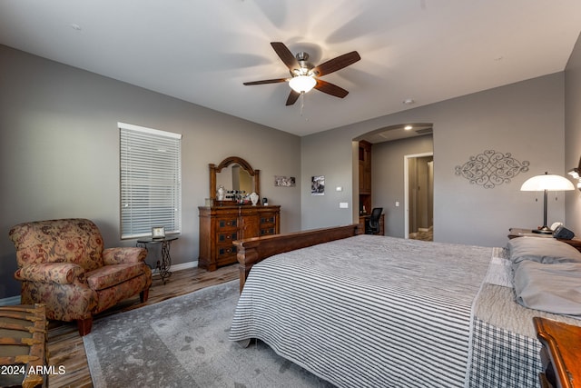 bedroom with ceiling fan and hardwood / wood-style floors