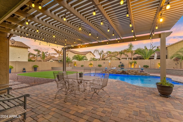 pool at dusk featuring a patio, a pergola, and pool water feature