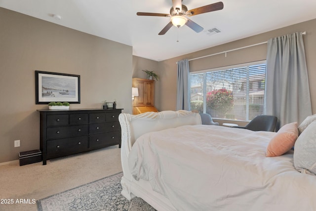 bedroom featuring carpet floors, a ceiling fan, baseboards, and visible vents
