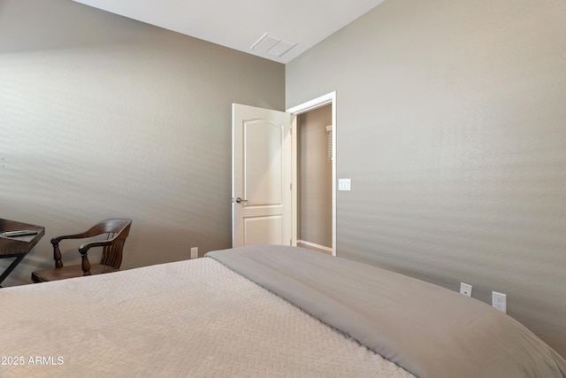 bedroom featuring visible vents