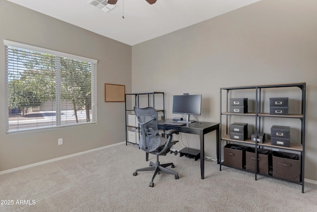 carpeted office featuring baseboards, ceiling fan, and visible vents